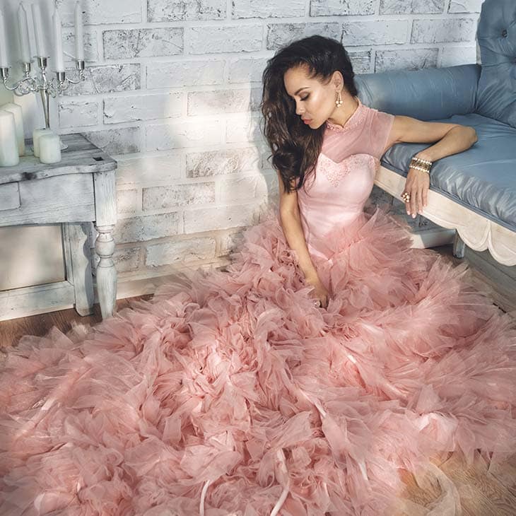 Lady pink dress sitting floor