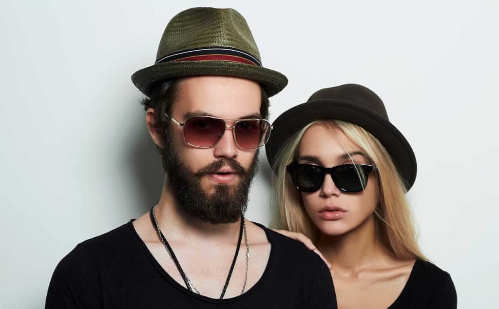 Couple wearing hats sunglasses