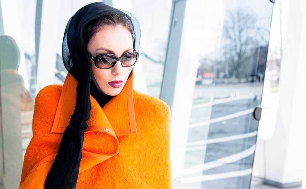 Woman sunglasses orange coat