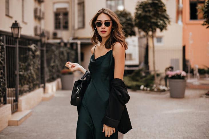 Woman black dress sunglasses street