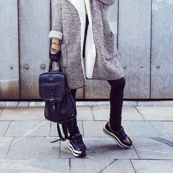 Woman selfie backpack platform sneakers