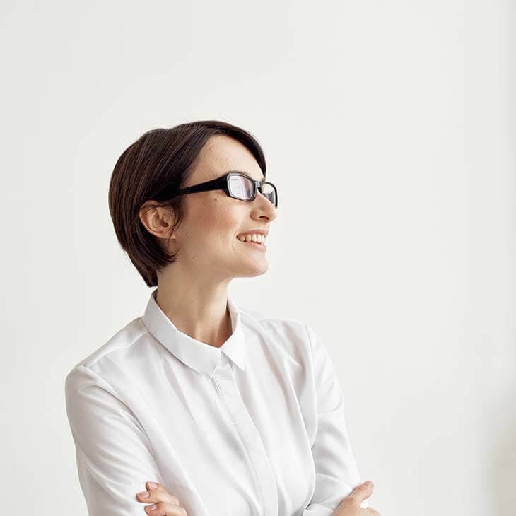Woman in white shirt with glasses
