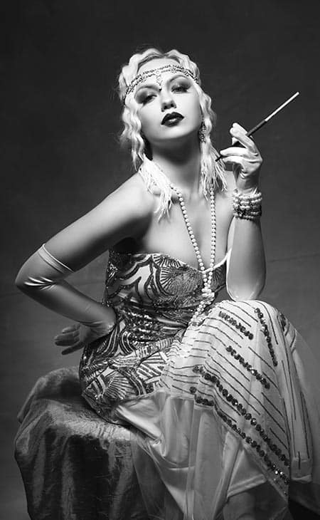 Woman 1920s headband flapper dress smoking