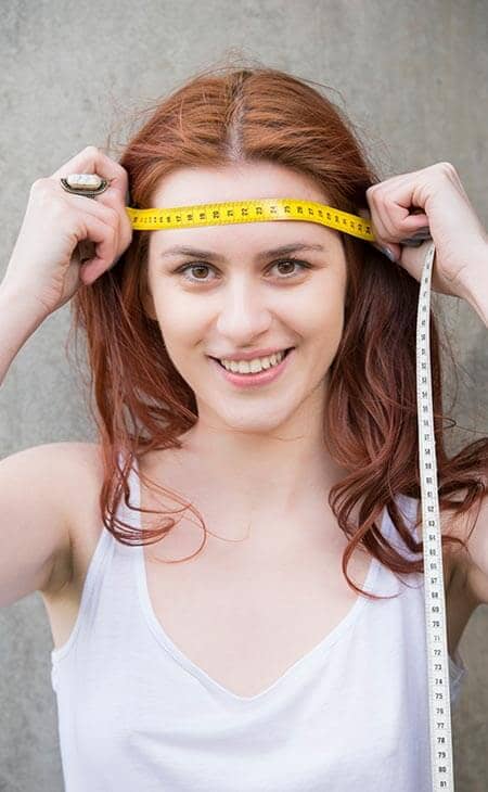 Woman measuring tape head