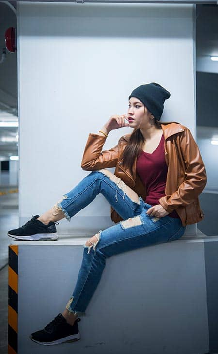 Woman sitting jeans beanie