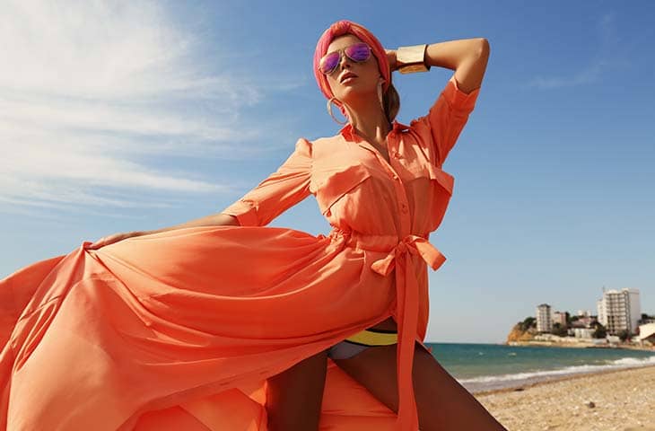 Woman posing beach fashion dress sunglasses