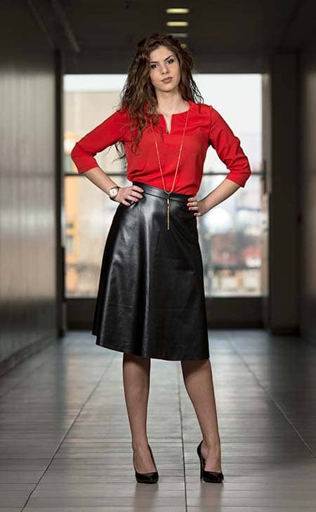 Woman red top black leather skirt