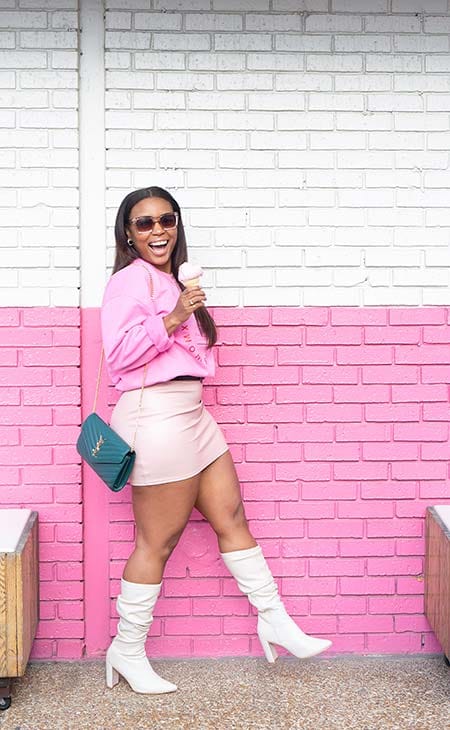 Woman posing miniskirt sunglasses pink