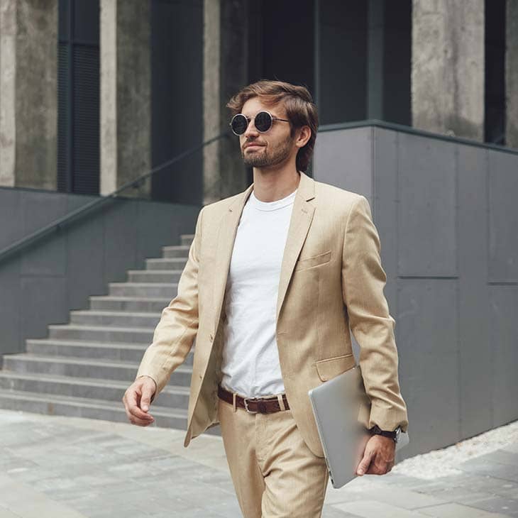 Man walking sunglasses beige