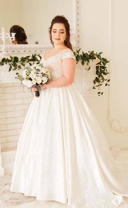 Woman posing wedding dress bouquet