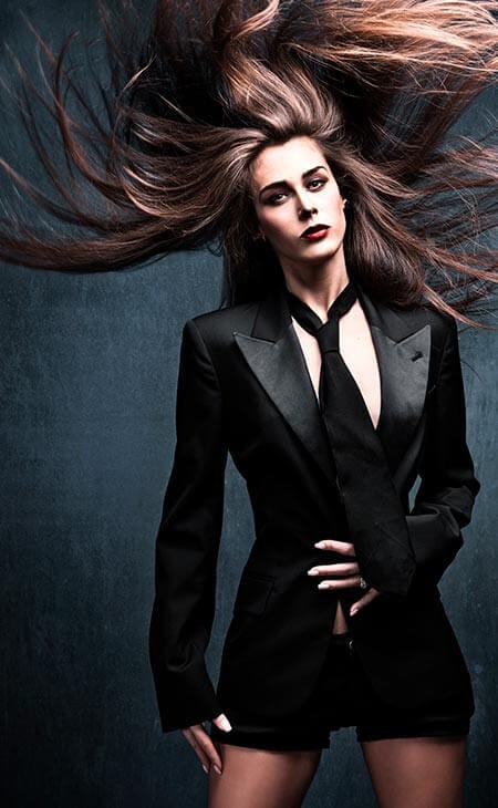 Woman posing long hair black outfit