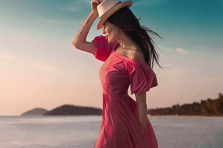 Woman pink dress on the beach