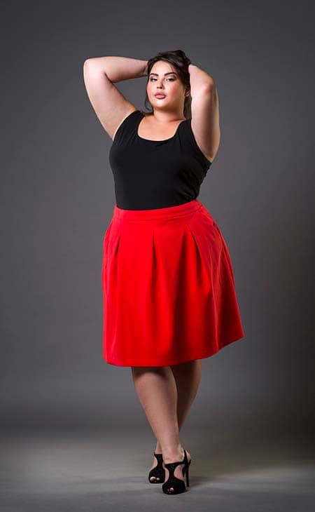 Model red skirt woman gray background
