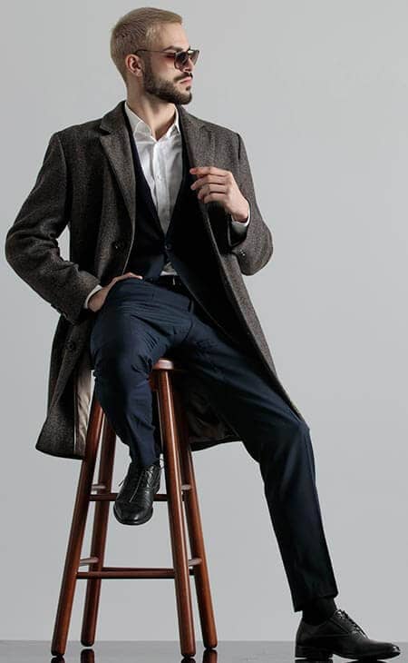 Formal guy suit coat sitting chair