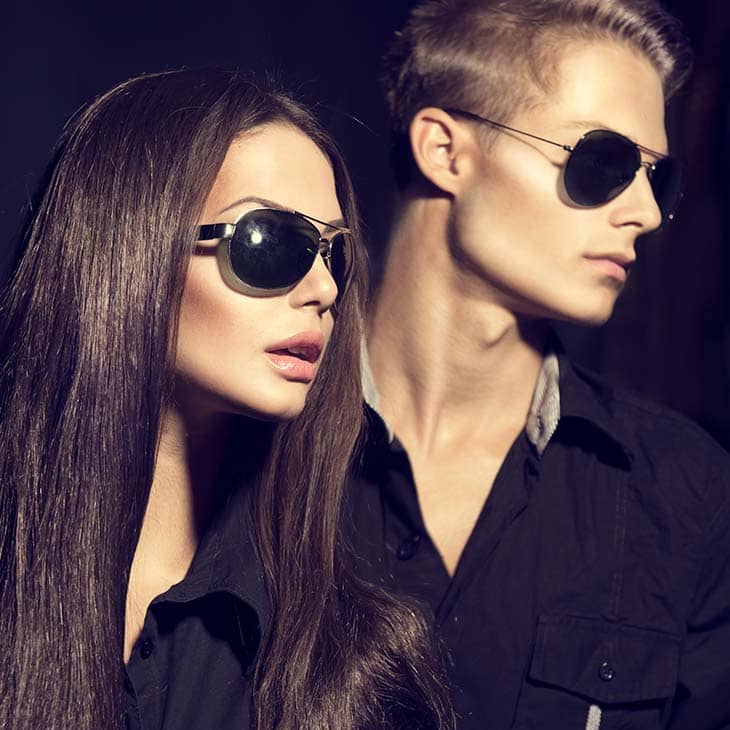 Woman man models posing sunglasses