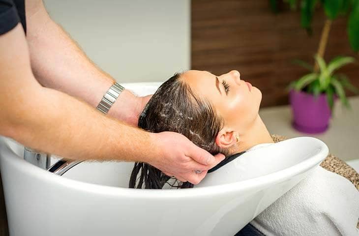 Woman washing hair beauty salon