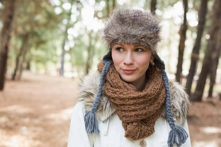 Woman fur hat woolen scarf woods