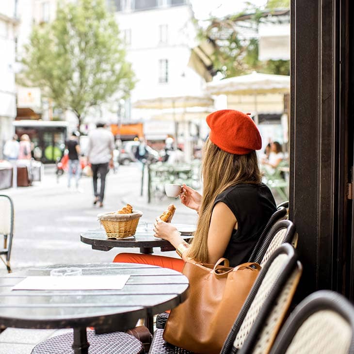 Woman beret coffee sitting oudoors cafe terrace