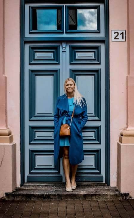 Woman posing door blue outfit