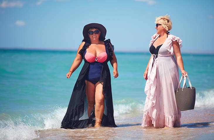 Two women beach walking dresses