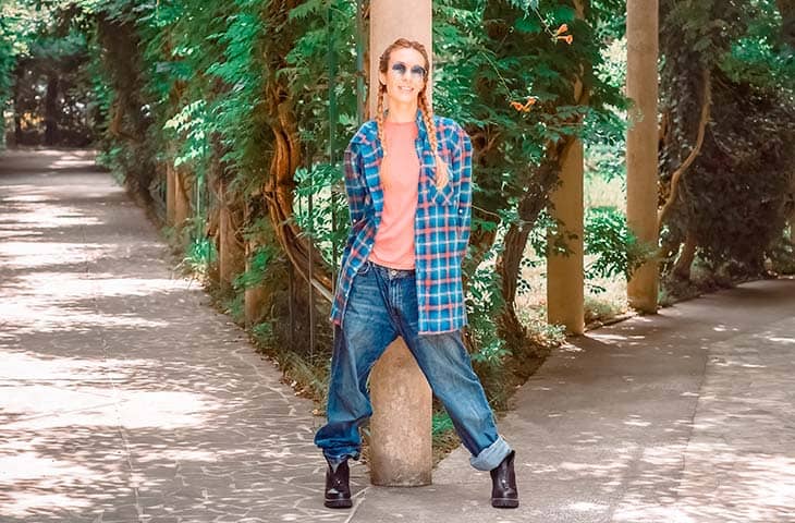 Woman posing outdoors sunglasses oversized shirt