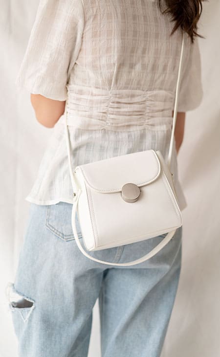 Detail behind woman flap purse