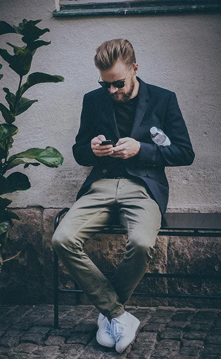 Man sitting outside using phone
