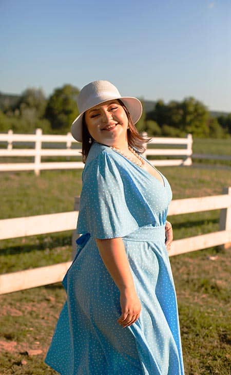 Woman posing outdoors blue dress