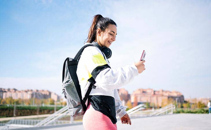 Woman smile backpack phone