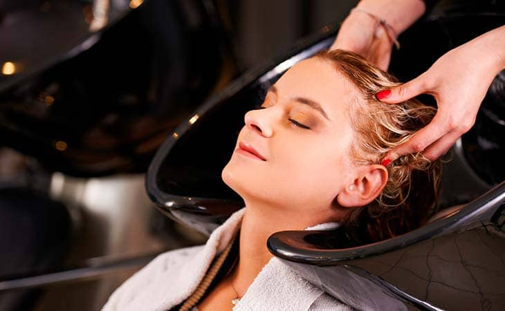 Relaxed woman salon hair washed