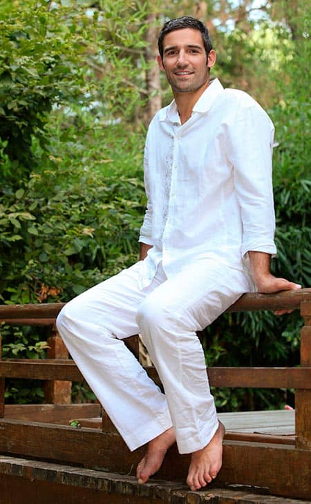 Man sitting garden white outfit