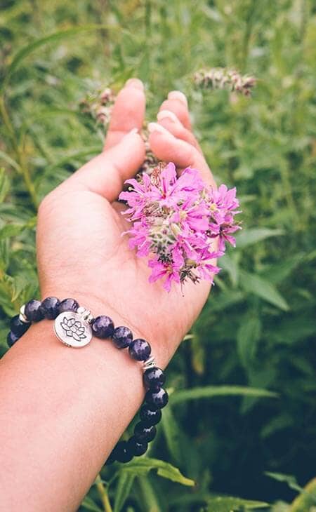 Hand holds flowers bracelet