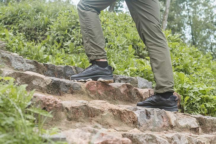 Men legs feet sneakers hiking nature