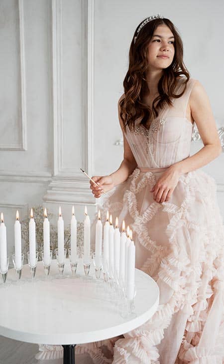 Young woman dress candles